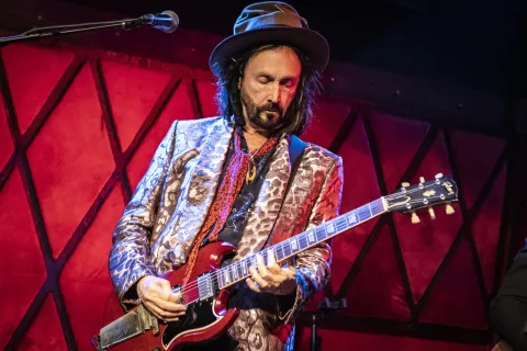 Mike Campbell playing guitar